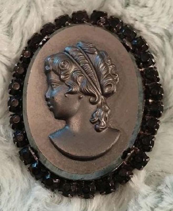 Front view of Black (jet) Oval Molded/Cut Brooch